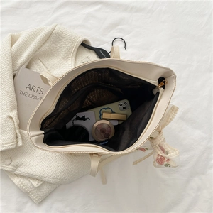 Minimalist straw woven tote bag with floral scarf and leather handles for women