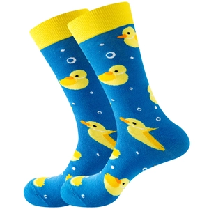 Blue cotton socks with yellow duck prints and ribbed cuffs on a white background