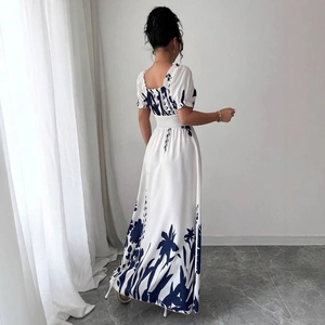 Floral A-line long dress with puff sleeves and shirred waist back view in white and blue