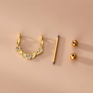 Golden stainless steel nipple bar with zircon wings and heart shaped leaf design