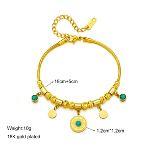 Gold 18K plated stainless steel beaded bracelet featuring a turquoise round pendant charm