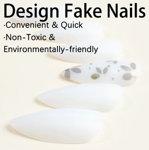 White stiletto press-on nails with elegant grey floral patterns and non-toxic finish