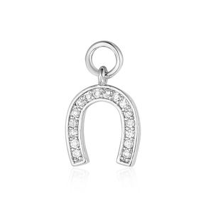 Close-up of a silver horseshoe pendant with inlaid sparkling crystals for DIY jewelry