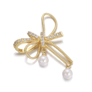 Macro view of 18K gold plated butterfly pendant with crystals and white pearl drops