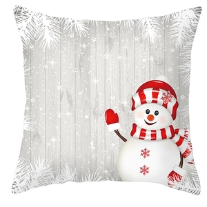 Detail of Christmas pillow cover with cute snowman, snowflakes and pine branch patterns