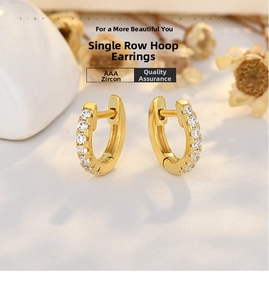 Close-up of gold plated silver hoop earrings with a row of sparkling AAA cubic zirconia