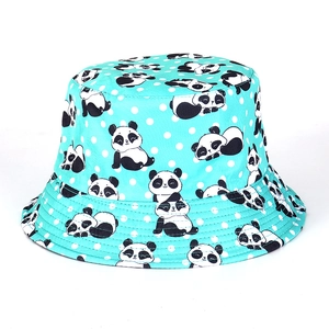 Detail of teal bucket hat featuring cute panda prints and white polka dot patterns