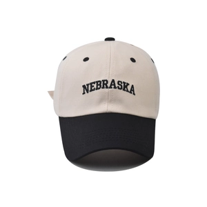 Classic Nebraska embroidered baseball cap with ivory crown and black contrast brim style