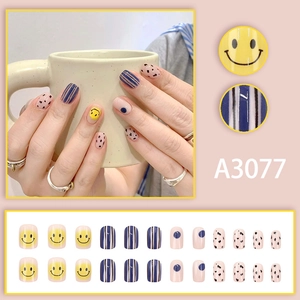 Japanese style black and blue checkered press-on nails with cute yellow smiley faces