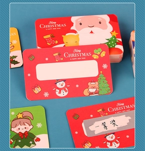 Close-up of Christmas scratch-off gift cards featuring festive cartoon Santa and reindeer
