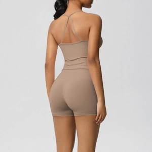 Close-up of cross-back yoga tank top and high-waisted shorts in khaki brushed fabric