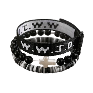 Detail of WWJD fabric wristband, cross beads, and grey heishi strand in a 3-piece set