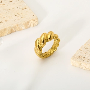 Detailed view of the 18K gold-plated croissant ring with a twisted texture design