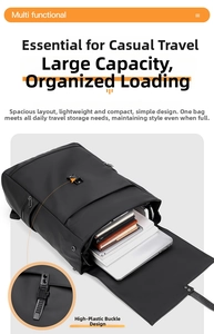 Detail view of large capacity black backpack showing laptop storage and buckle system