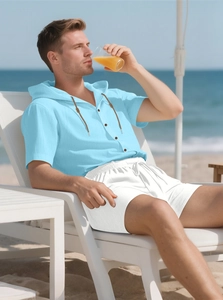 Sky blue hooded linen shirt and white drawstring shorts set on beach vacation