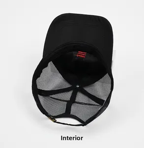 Detail of black mesh baseball cap internal structure with red stitching and adjustable strap