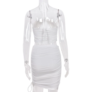 Rear view of white halter neck crop top and ruched mini skirt set on a mannequin