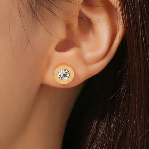 Rose gold Roman numeral stud earrings with a central cubic zirconia for women