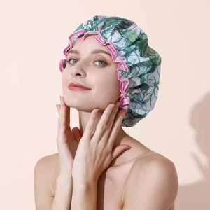 Waterproof double-layer shower cap with green leaf print and pink ruffled trim