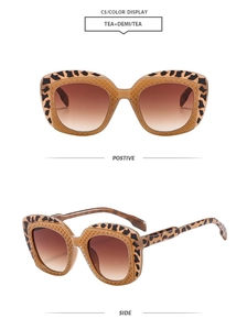 Detail of tortoise shell sunglasses frame with gradient brown lenses in a square design