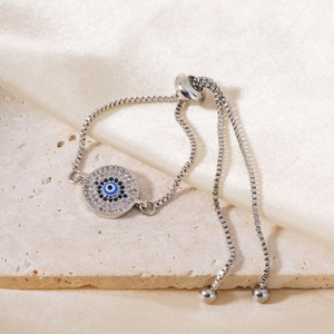 Close-up of silver Evil Eye bracelet with blue and white zircons and adjustable slider
