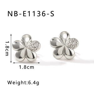 Detail view of five-petal flower stud earrings with crystals and size markings