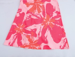 Close-up of lightweight chiffon fabric with vibrant abstract tie-dye floral patterns