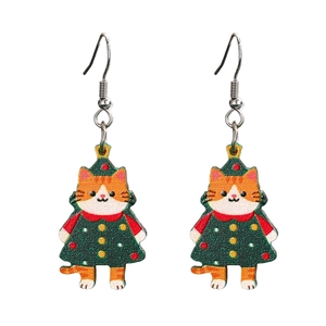Detail of Christmas cat earrings featuring an orange cat in a green festive dress