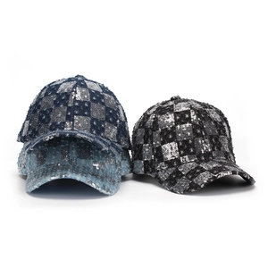 Stylish checkered sequin baseball cap with vintage frayed edges in blue and black colors