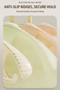 Close-up of non-slip ridges on cream-colored wide shoulder hanger with matte finish