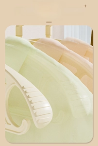 Close-up of non-slip ridges on cream-colored wide shoulder hanger with matte finish