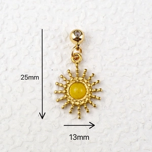 Golden sun charm with yellow gemstone measuring 25mm in length and 13mm in width