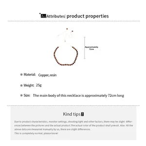 Detail view of tiger eye resin beaded necklace with copper material and length specs