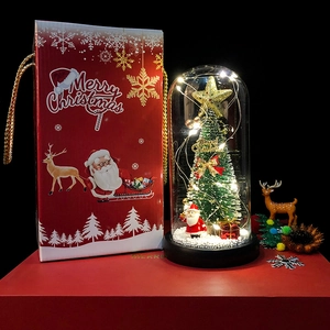 Christmas tree glass dome with LED lights, Santa figurine, and red holiday gift box