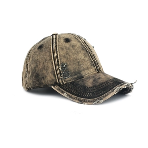 Distressed vintage washed denim baseball cap with ripped hole details in retro style