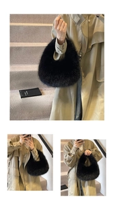 Close-up of black fuzzy faux fur handbag paired with an elegant khaki trench coat