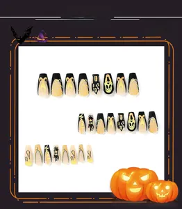 Detail of Halloween coffin nails featuring spider web, skull, and pumpkin patterns