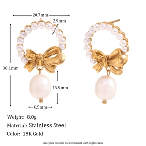 Detailed view of 18K gold plated stainless steel bow earrings with hanging pearls
