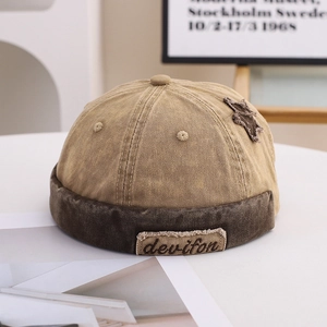 Close-up of vintage patchwork docker hat with star patch and embroidery detail