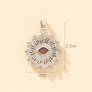 Detailed view of silver evil eye pendant with red gemstone and size dimensions