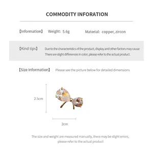 Detailed size specifications for gold-plated copper bow brooch with zircon inlay
