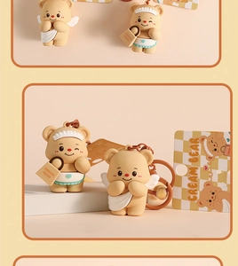 Detailed views of cute cream bear keychains in angel and apron outfits on display