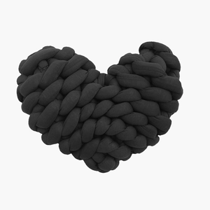 Macro shot of the black heart-shaped pillow featuring thick hand-knotted braided texture
