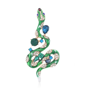Exaggerated vintage snake brooch with green enamel and vibrant blue gemstones