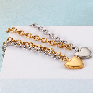 Modern two-tone heart pendant thick link bracelet in gold and silver stainless steel