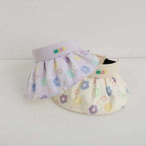 Detail of wide brim sun hats with floral rabbit prints and colorful miss letter patches