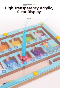 Detailed close-up of a wooden magnetic color sorting maze with beads and a stylus pen