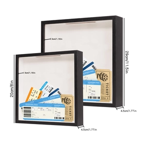 Detailed view of two black wooden shadow boxes for tickets in large and small sizes