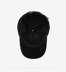 Detail of warm winter hat showing black faux fur ear flaps and high-quality inner lining
