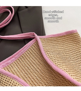 Close-up of contrast stitching on woven straw tote bag with pink ribbon edge detail
